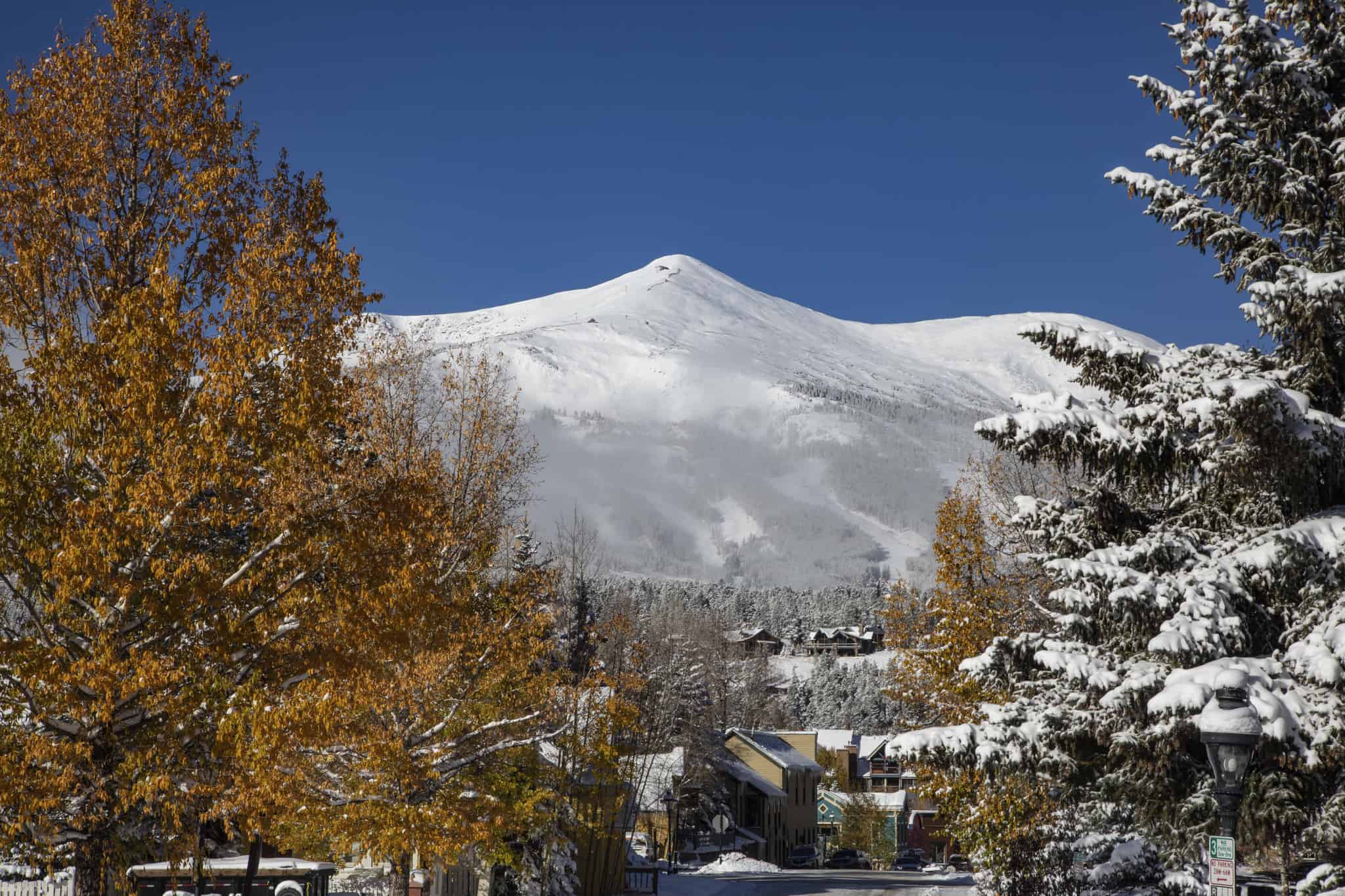 Snow-covered mountain behind town