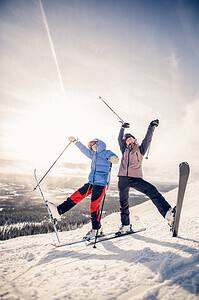 Two girls skiing