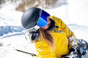 Woman skiing and smiling into sun