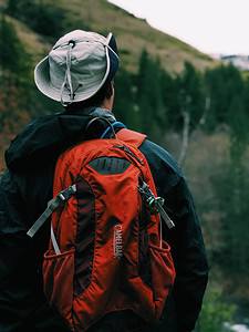 Man hiking in mountains, backpack