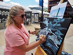 Woman painting in Breckenridge