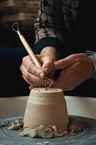 man shaping pot