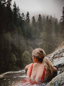 woman soaking in hot springs