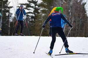 man skate skiing with elf hat