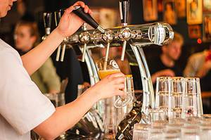 Woman pouring beer