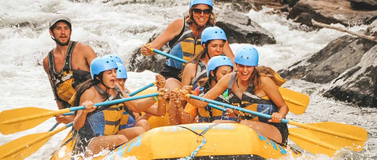 group of women whitewater rafting